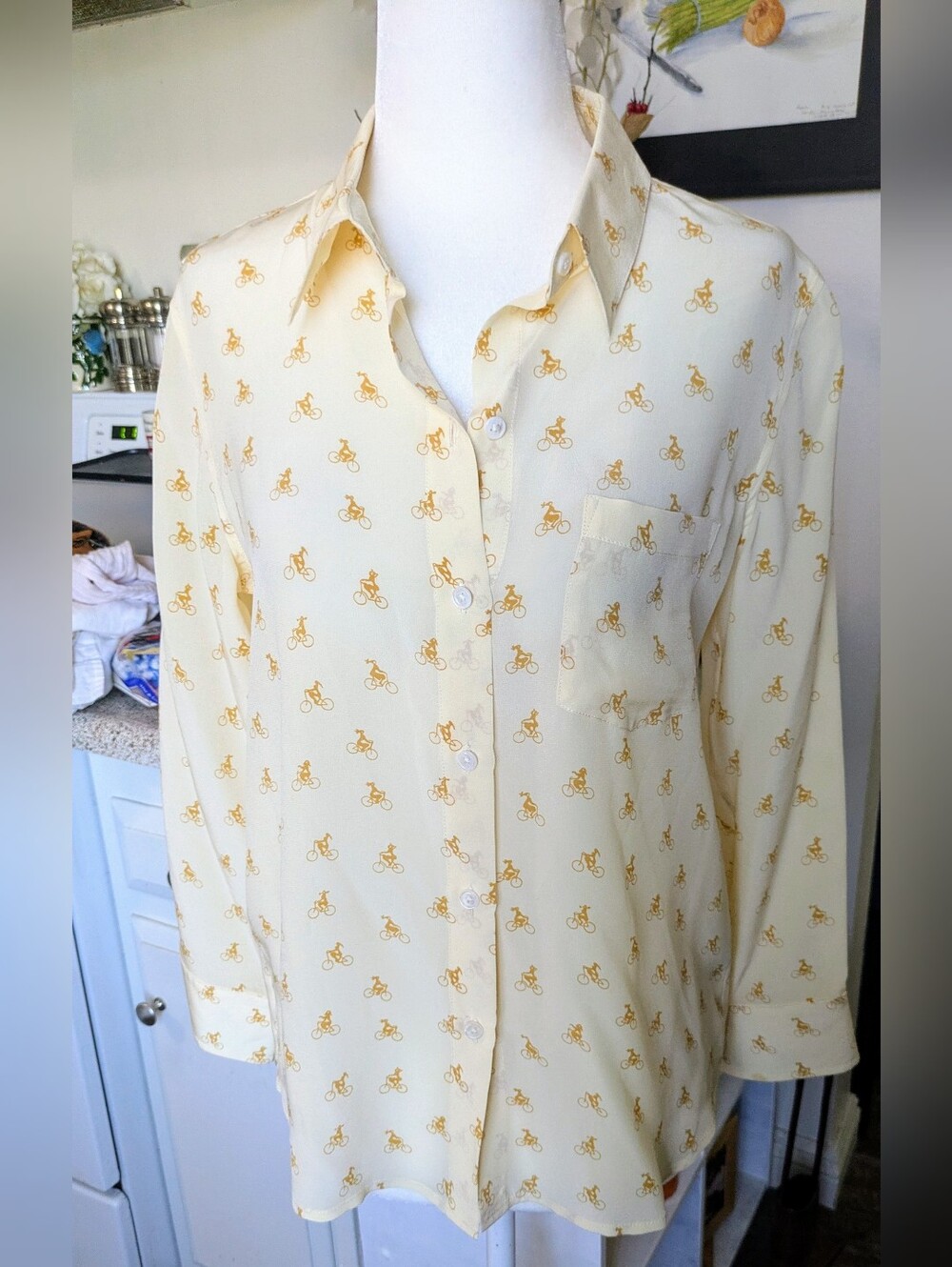 Club Monaco 100% Silk Blouse in a beautiful pale yellow with a subtle whimsical